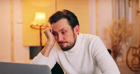 Sad tradesman receiving email message with bad news obout transaction. Serious Stock Footage 146039772