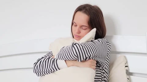 Sad unhappy brown haired young adult woman having upset facial expression Видео 260792234