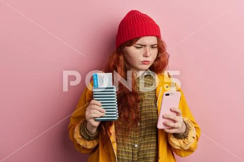 Sad unhappy female tourist reading sad information, news from smart phone Stock Photos