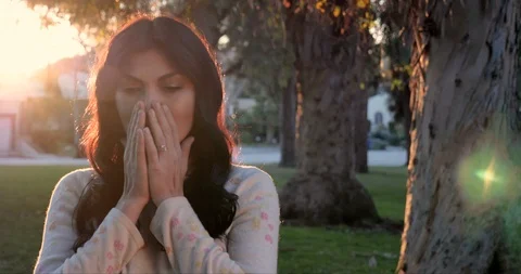 A Sad, Upset and Crying Young Woman Backlit Sunset Outdoors Portrait Stock Footage 122256369