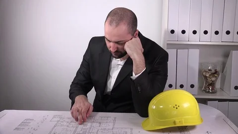 Sad upset architect finding errors blueprints building development wrong job 4K  Stock Footage 72900622