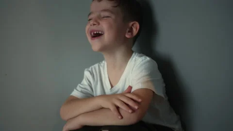 Sad upset boy sitting in corner lifestyle. Child abuse. Portrait of a Cute boy Stock Footage 219991338