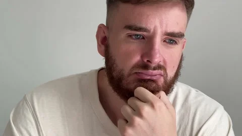 Sad upset desperate depressed stressed young handsome man is suffering, crying Stock Footage 232286705