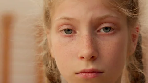 Sad upset kid face close up Caucasian girl teen child schoolgirl daughter 動画素材 294261792