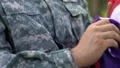Sad US army soldier crying holding flag, memorial ceremony for killer soldiers HD Footage
