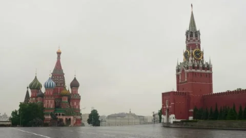 Sad view of empty Red square with St Basil's cathedral clock tower during rainy Stock Footage 133245653