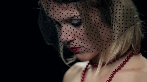 Sad widow posing on black background. High definition video Stock Footage 82639083