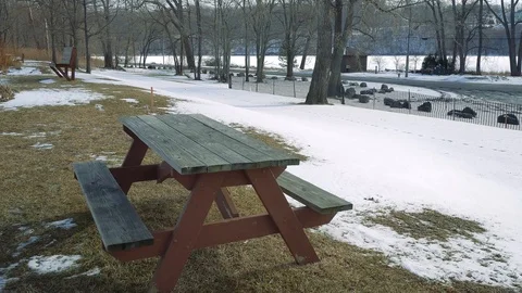 Sad Wintertime Picnic Table on Great Lake Ontario Stock Footage