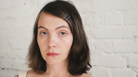 Sad woman looking into the camera Stock Footage 67953789