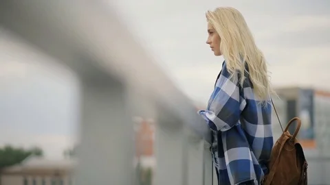 Sad woman looking to cityscape Stock Footage