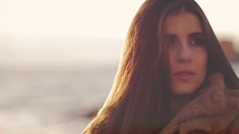 Sad woman looking sunset in front of the ocean closeup Stock Footage 76847476
