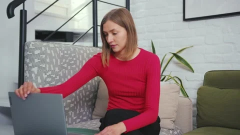 Sad woman working laptop computer worried at home workplace computer technology Stock Footage 132537963
