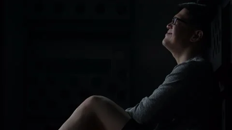 Sad young asian man sitting on the floor checking mobile phone with bad news Stock Footage 136957161