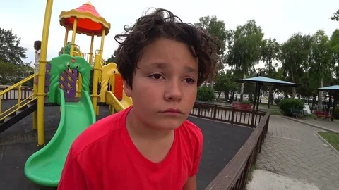 Sad young boy at the playground 2 Stock Footage 76282973