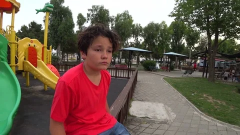 Sad young boy at the playground 3 Stock Footage 76283696