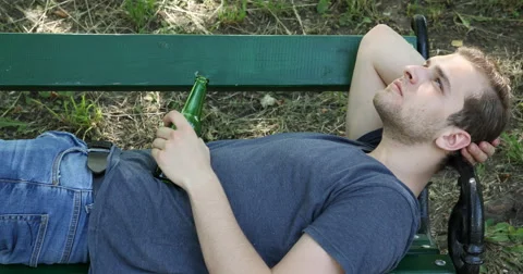 Sad Young Boy Sitting on Park Bench Man Having Drink Problem Alcohol Addiction Stock Footage 67862075