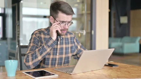 Sad Young Designer having Shock on Laptop in Modern Office Stock Footage 119342122