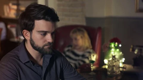 Sad young latin man alone at the bar drinks beer to forget Video stock 74715529