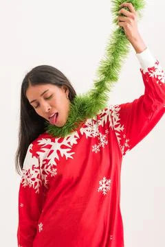 Sad young latina hate christmas and new year. funny expresion Stock Photos