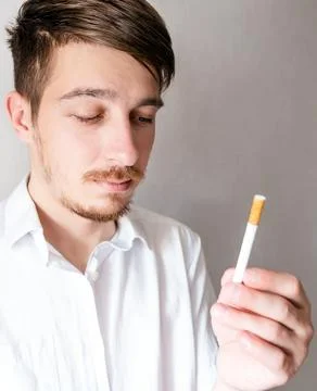 Sad Young Man with a Cigarette Stock Photos