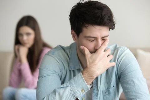 Sad young man crying, having problems, in despair or depression Stock Photos