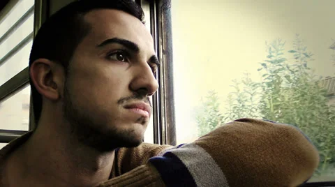 Sad young man on a train Stock Footage 34273634