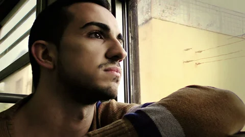 Sad young man on a train Stock Footage 34273670