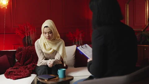 Sad young Middle Eastern woman talks to psychologist during therapy session Stock-Footage 343985883