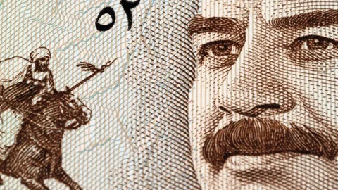 Saddam Hussein on Iraq dinar note macro tracking. Slider shot. Low angle, 4K Stock Footage 127426552