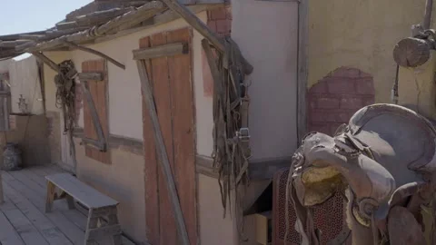 Saddle in old western set Stock Footage 287643763