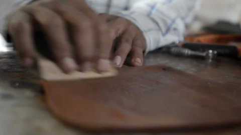 A saddler working the skin Stock Footage 96184783
