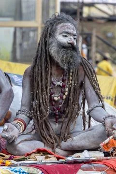 Sadhu baba with long dreadlocks and sacred ash sitting during spiritual gat.. Stock Photos
