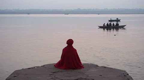 Sadhu Sitting by the Ganges River in Varanasi, Uttar Pradesh, India Stock Footage 44407188