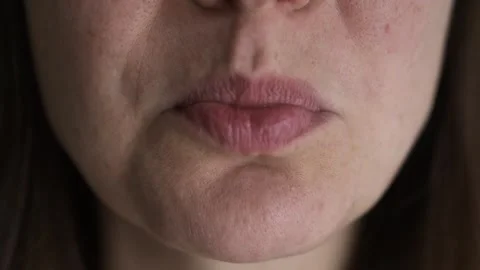 Sadness. Close-up of a girl experiencing a feeling of sadness and annoyance.. Video stock 327559959