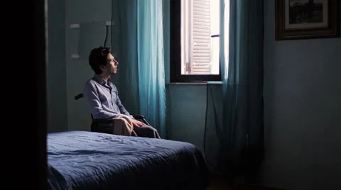 Sadness of a disabled person forced to sit on a wheelchair - handicapped Stock Footage 24771294