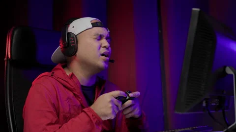 Sadness gamer man play computer pc wearing headset. He lose in the game. Missed  Stock Footage 162372110