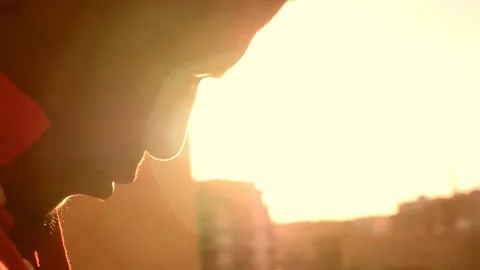Sadness, thoughts - sad face of depressed african young man in sunset light Stock Footage 240323017