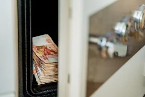 The safe is ajar and banknotes with a face value of five thousand Russian rubles Stock Photos