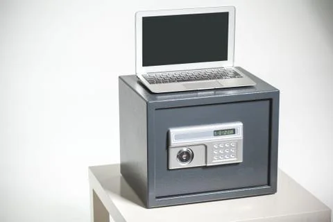 Safe and laptop Stock Photos