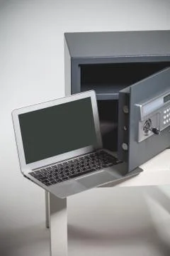 Safe and laptop Stock Photos