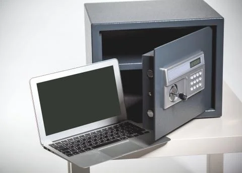 Safe and laptop Stock Photos