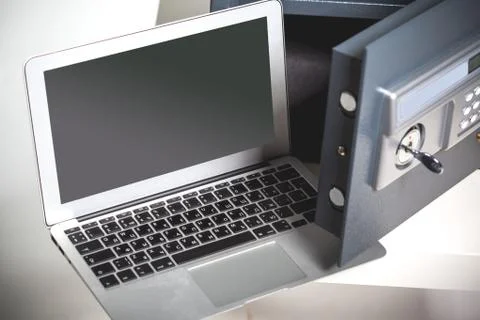 Safe and laptop Stock Photos