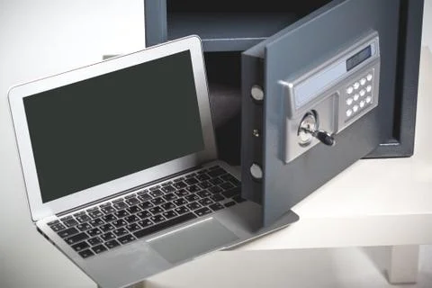 Safe and laptop Stock Photos