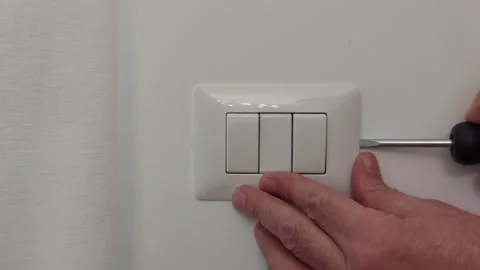 Safe and Simple: Removing an Electric Switch Cover Stock Footage 306063337