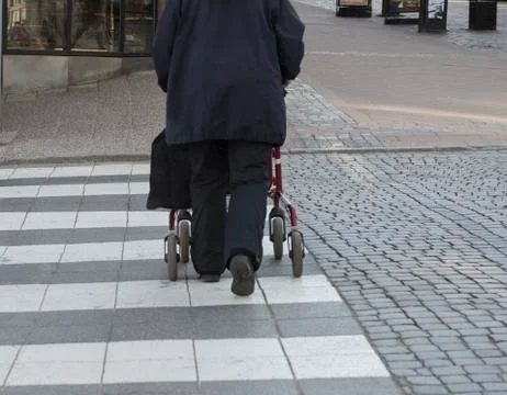 Safe crossing with rollator Stock Photos