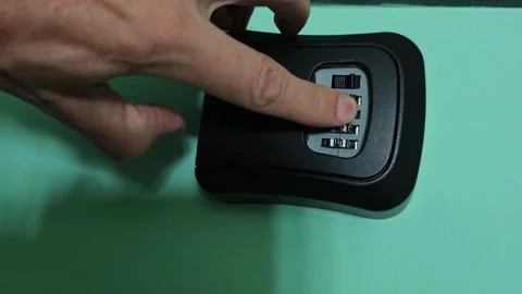 Safe deposit box opening for apartment key storage at home Stock Footage 342743714