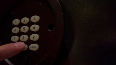 The safe door opens as a man hand presses code Stock Footage 288307150