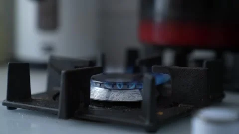 Safe indoor cooking flame, gas ring with visible heat, blue fire ring on burner Stock Footage 314683917