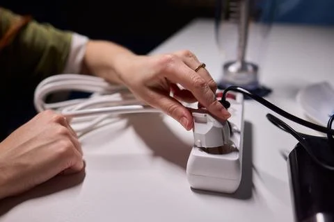 Safe plug connection demonstration, Careful connection of electrical device to Stock Photos