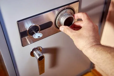 Safe with security code for finances and documents. Opening a coded safe. Stock Photos